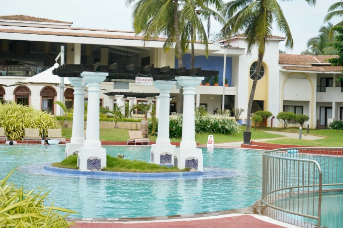 white concrete building near swimming pool during daytime